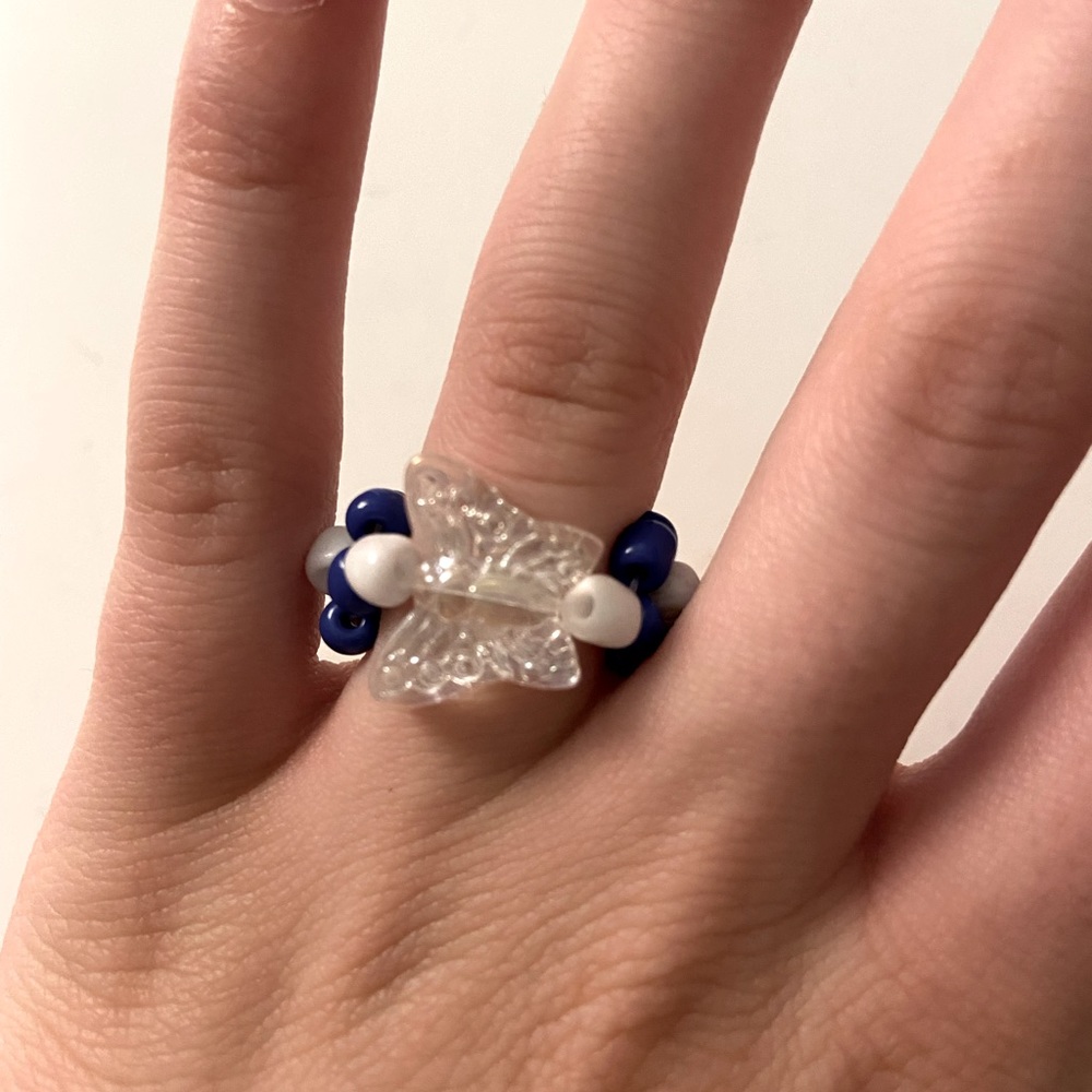 handmade beaded ring with flowers and butterfly